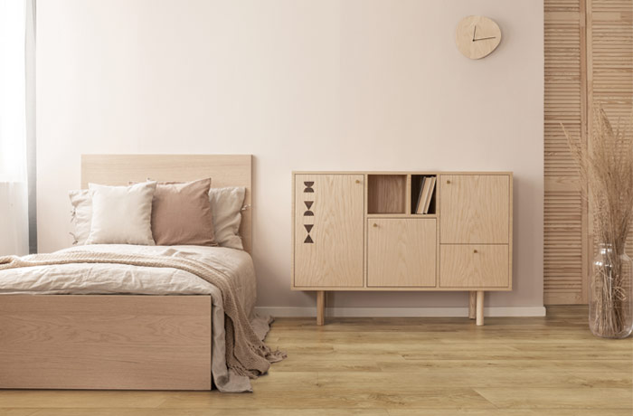 mocha toned bedroom with woodlook floors